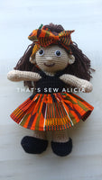 Crochet doll with African print skirt